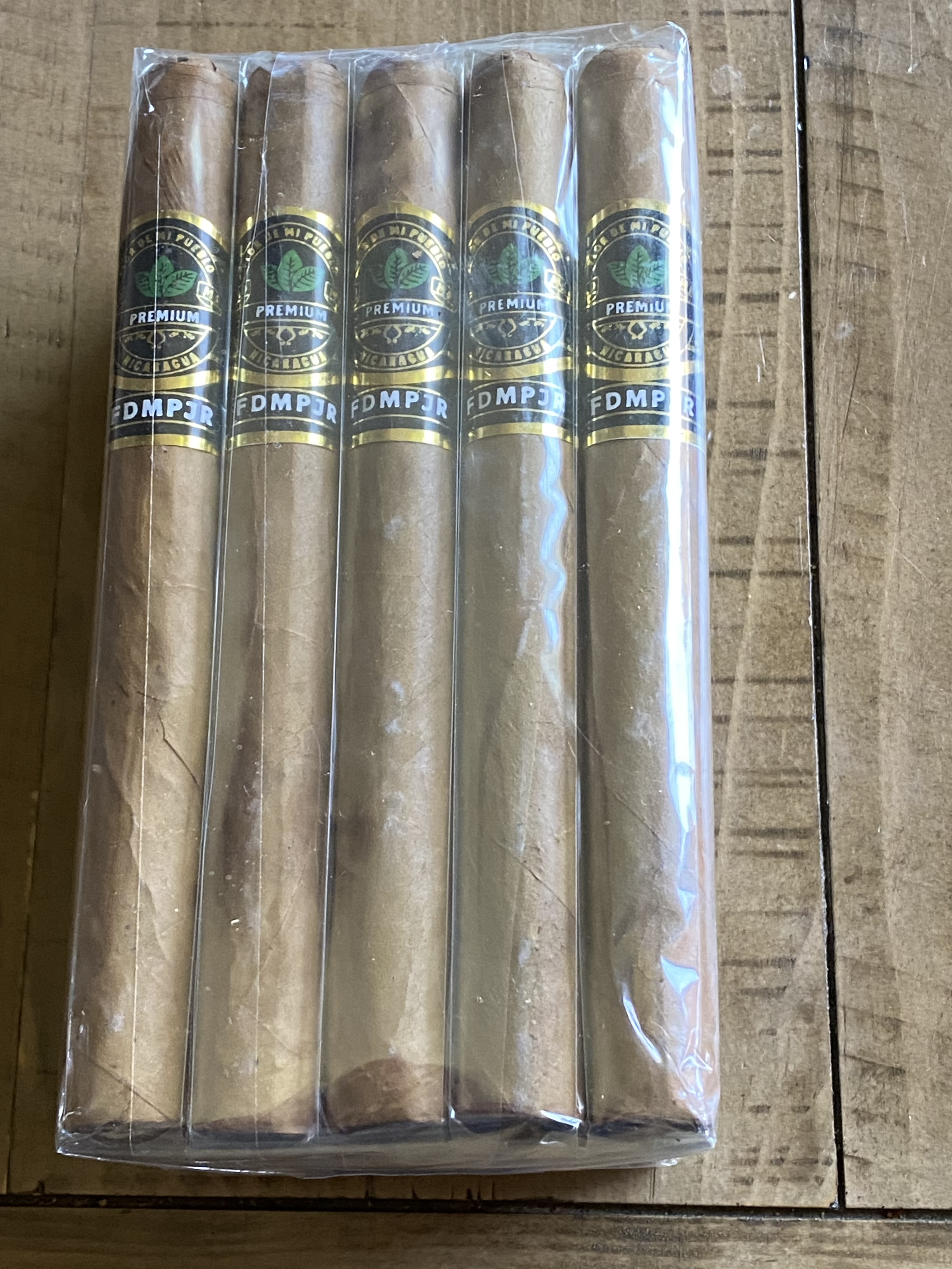 Pack of five Nicaraguan premium cigars in plastic wrapping.